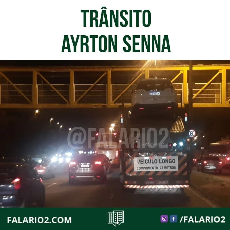 21:10 Carreta com excesso de altura ocupa uma faixa da pista central da Av.